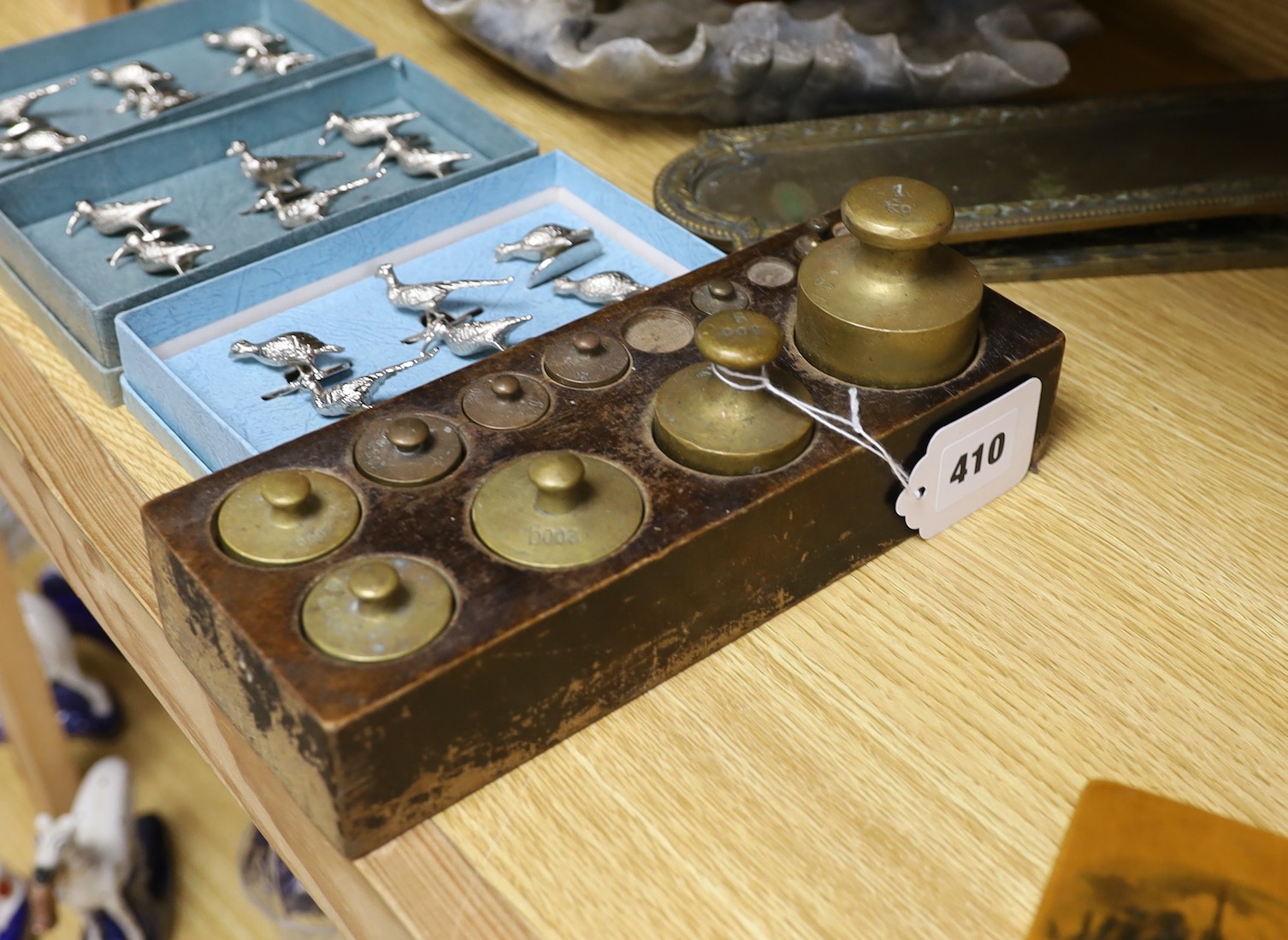 A weight set, a Danish leather bound cup measurement set marked ‘Ria Denmark, three sets of bird menu holders, and other items